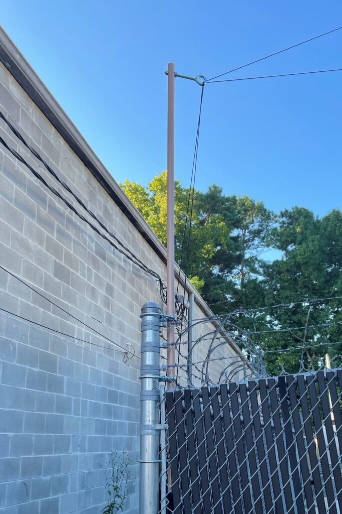 Elevated Guy point installation on a fence post view 4 1500x1000 - Max-Gain Systems Inc
