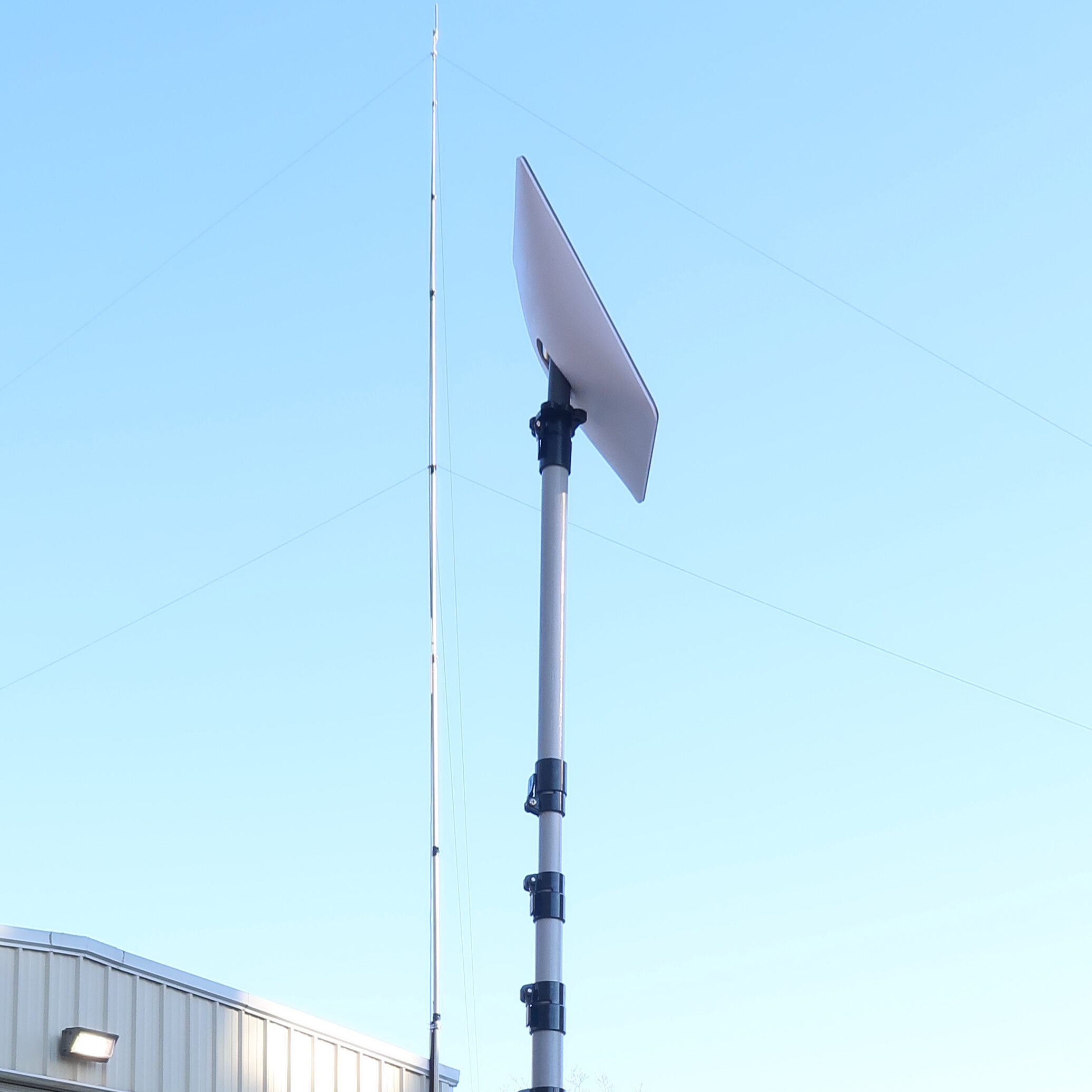 Starlink-mounted-on-top-of-a-fiberglass-push-up-mast - Max-Gain Systems Inc